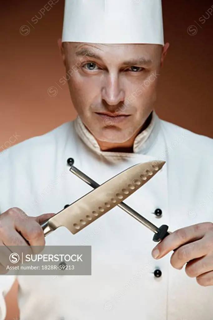 Portrait of Chef Sharpening Knife   