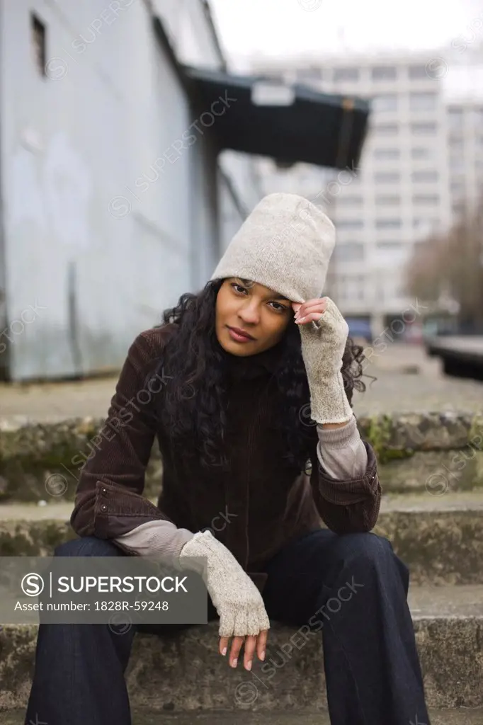 Portrait of Woman in Urban Industrial Area, Portland, Oregon, USA   