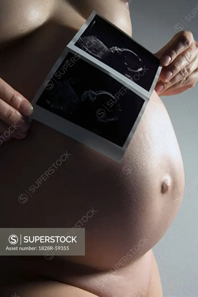 Pregnant Woman with Ultrasound Photograph of Baby