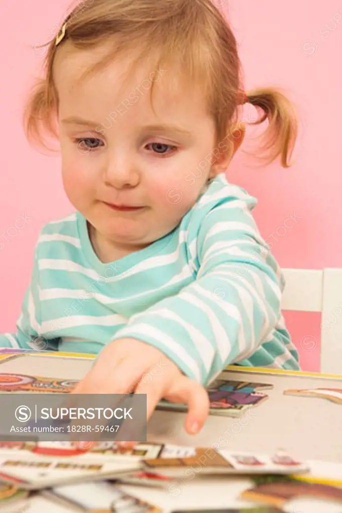 Little Girl Doing a Puzzle   