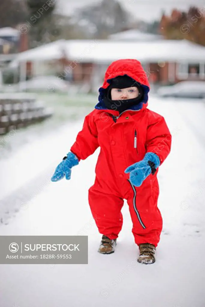 Little Boy Playing Outdoors in Winter, Portland, Oregon, USA   