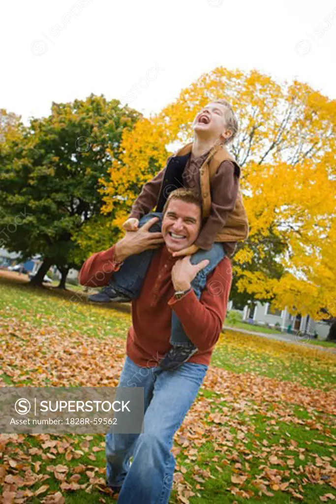 Little Boy Riding on His Father's Shoulders, Portland, Oregon, USA   
