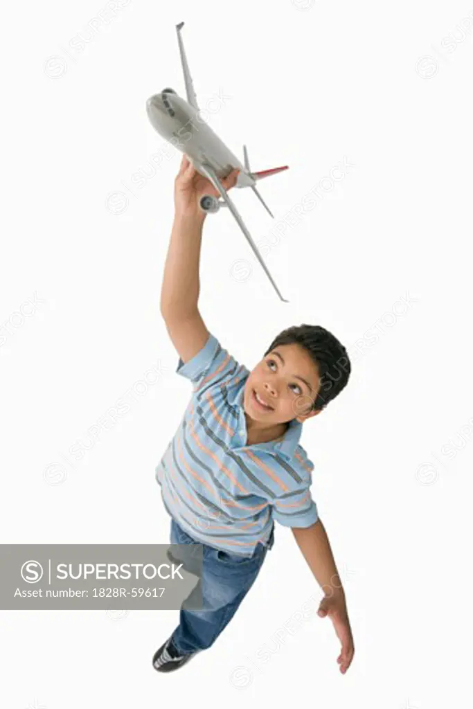 Boy Playing with Toy Airplane   
