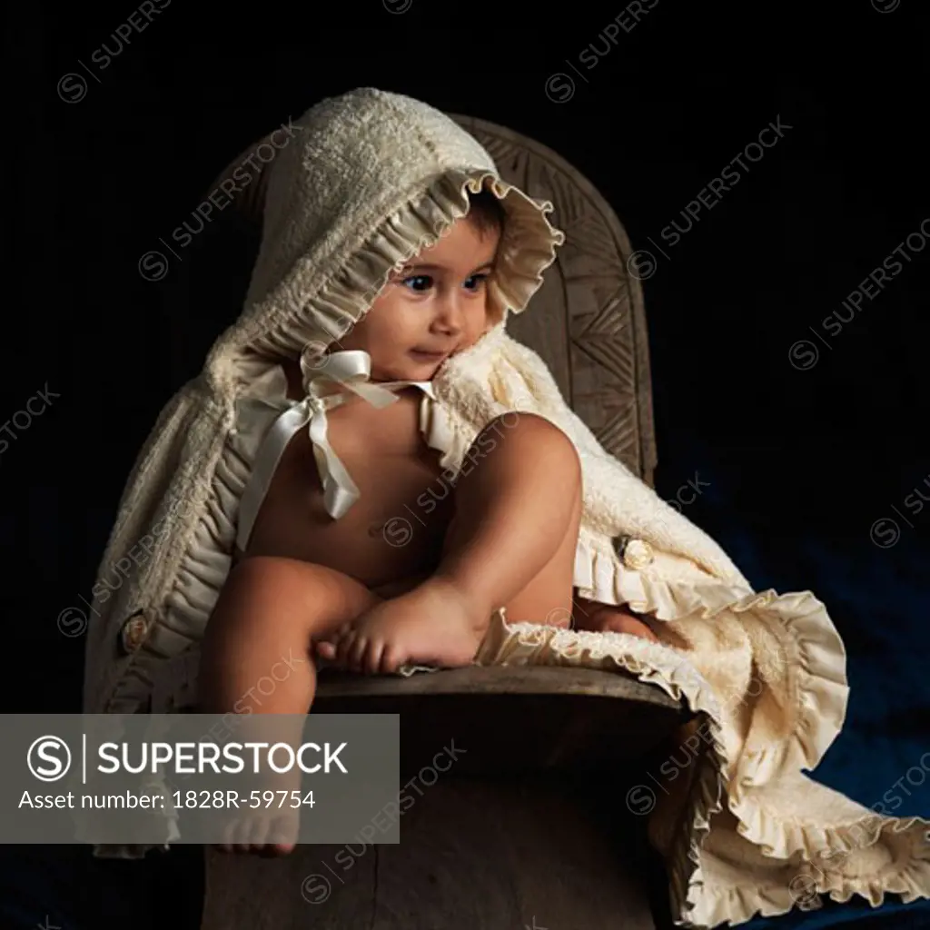 Young Child Wearing Hooded Blanket   