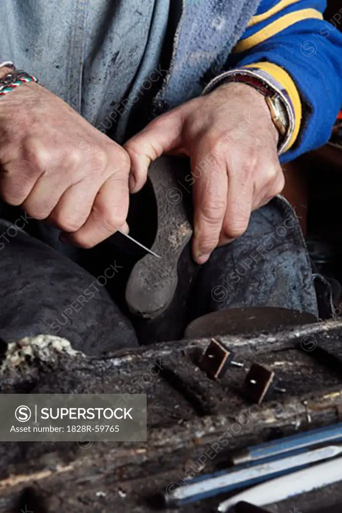 Italian Shoemaker Cutting the Heel of a Boot   