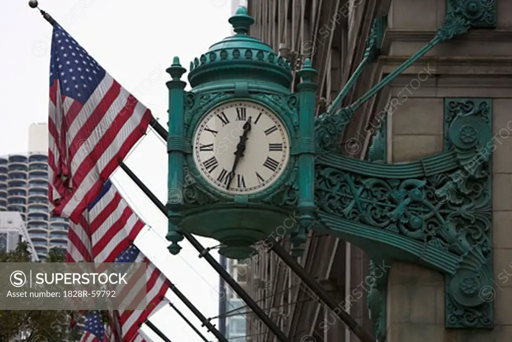 Clock and American Flags on Building, Chicago, Illinois, USA   