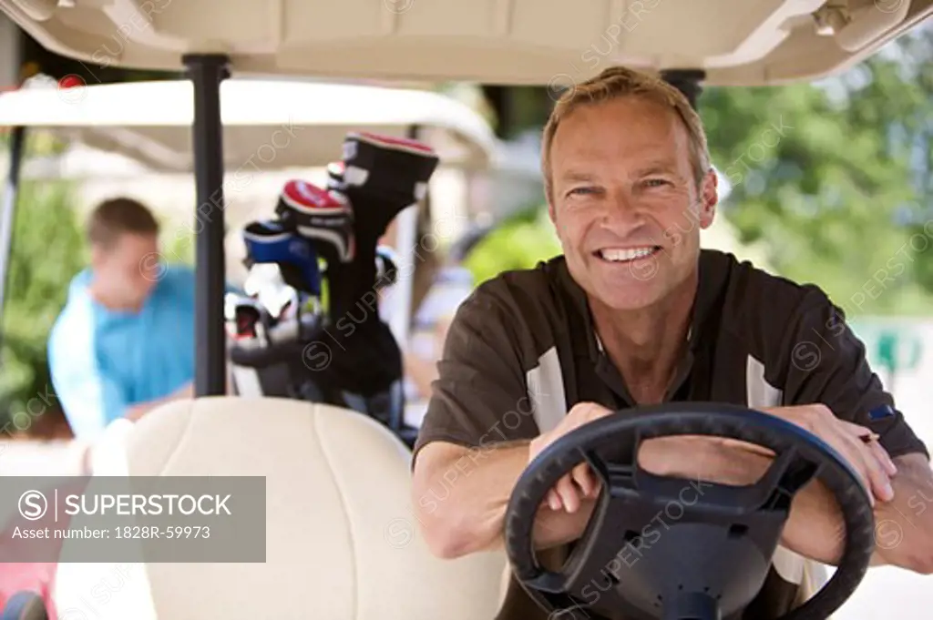 Portrait of Man in Golf Cart   
