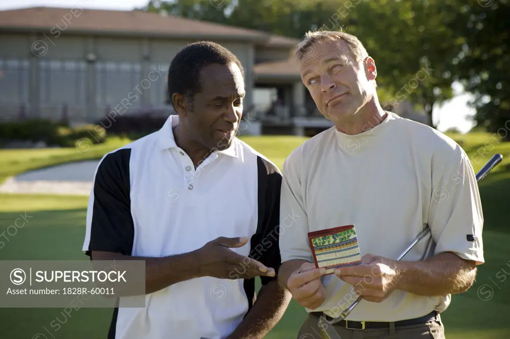 Golfers Looking at Score Card, Burlington, Ontario, Canada   