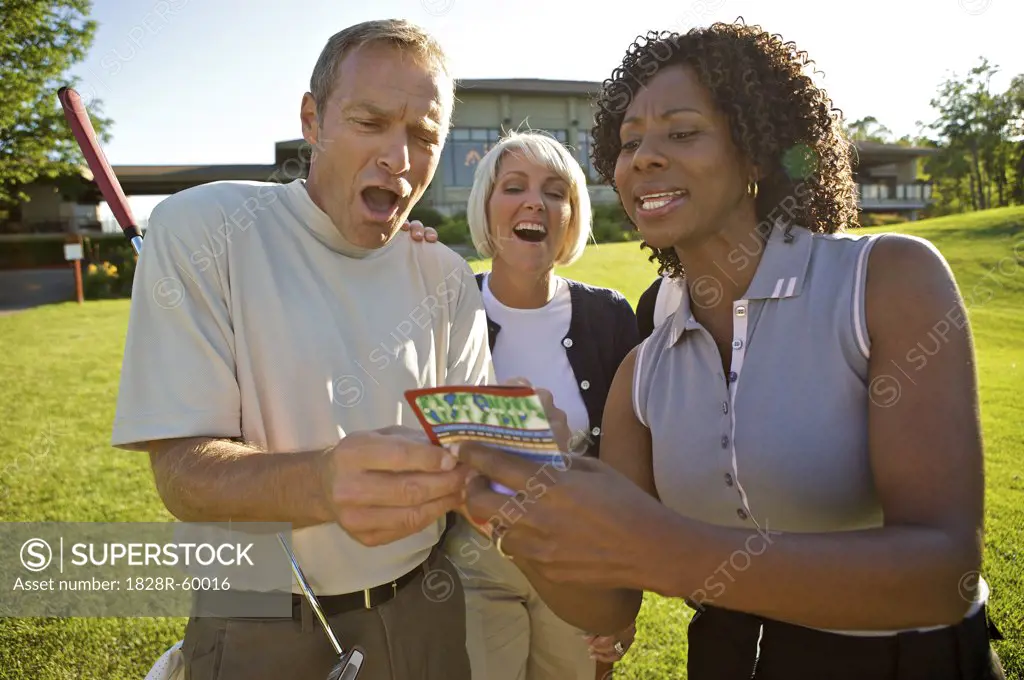 Golfers Looking at Score Card, Burlington, Ontario, Canada   
