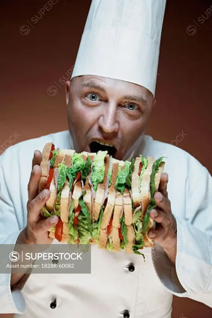 Chef About to Bite Big Sandwich   