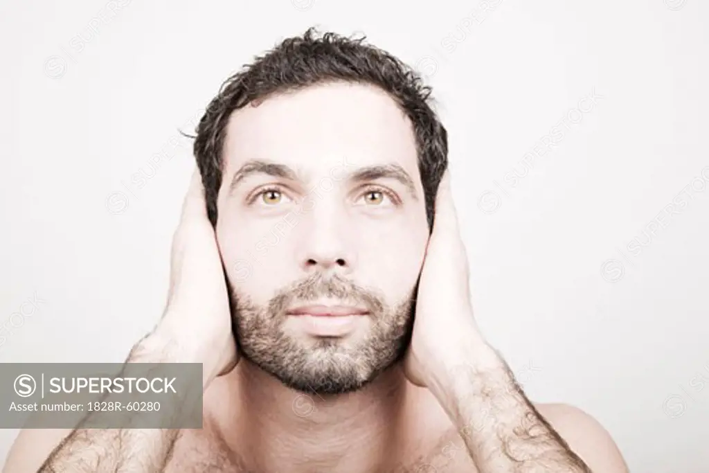 Portrait of Man Covering His Ears   