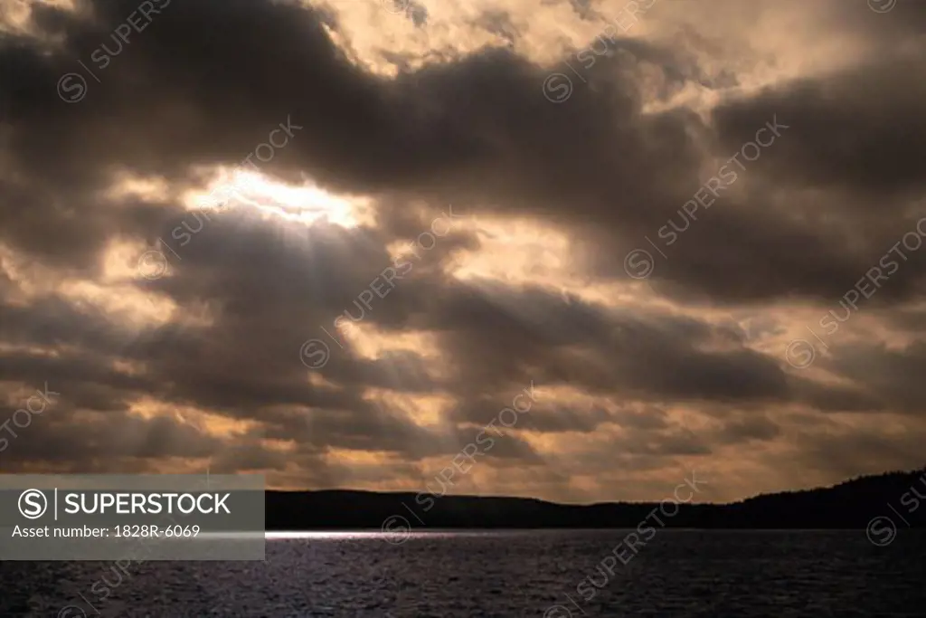 Sunlight through Clouds over Cedar Lake, Algonquin Provincial Park, Ontario, Canada   