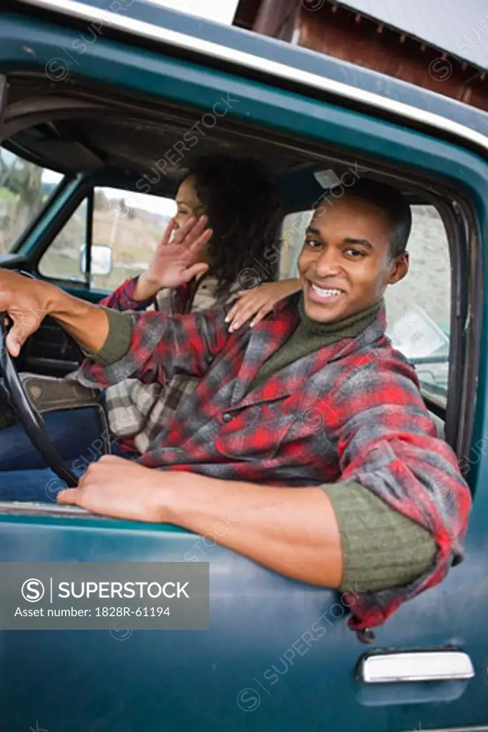 Young Couple in a Vintage Pickup Truck on a Farm in Hillsboro, Oregon, USA   