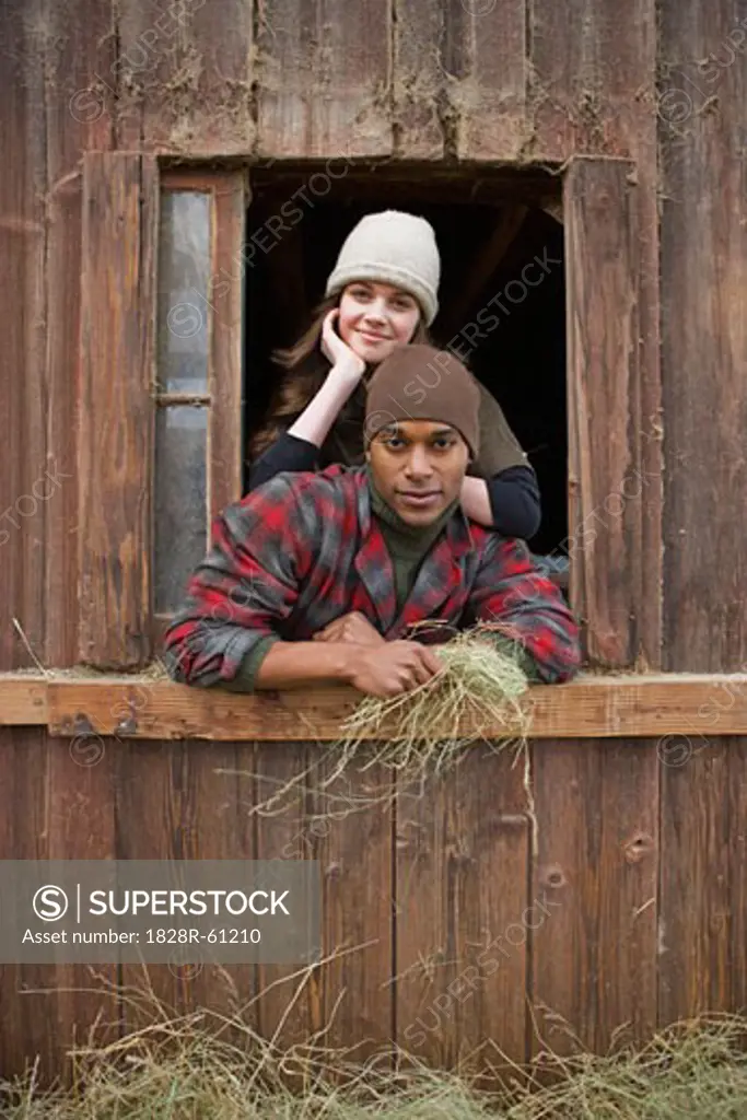 Portrait of Couple Leaning Out Barn Window on a Farm in Hillsboro, Oregon, USA   