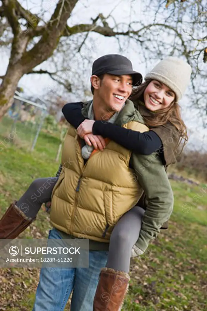 Teenage Boy Giving Girlfriend a Piggyback Ride, Hillsboro, Oregon, USA