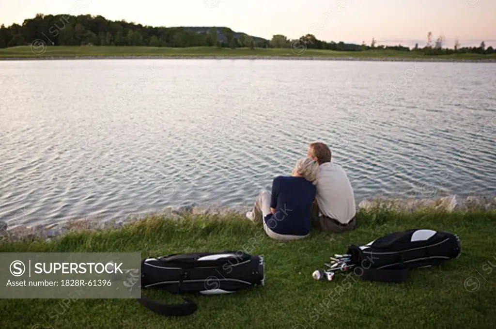 Couple Sitting by Pond on Golf Course, Burlington, Ontario, Canada   