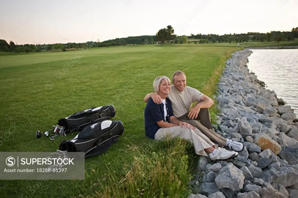 Couple Sitting by Pond on Golf Course, Burlington, Ontario, Canada   