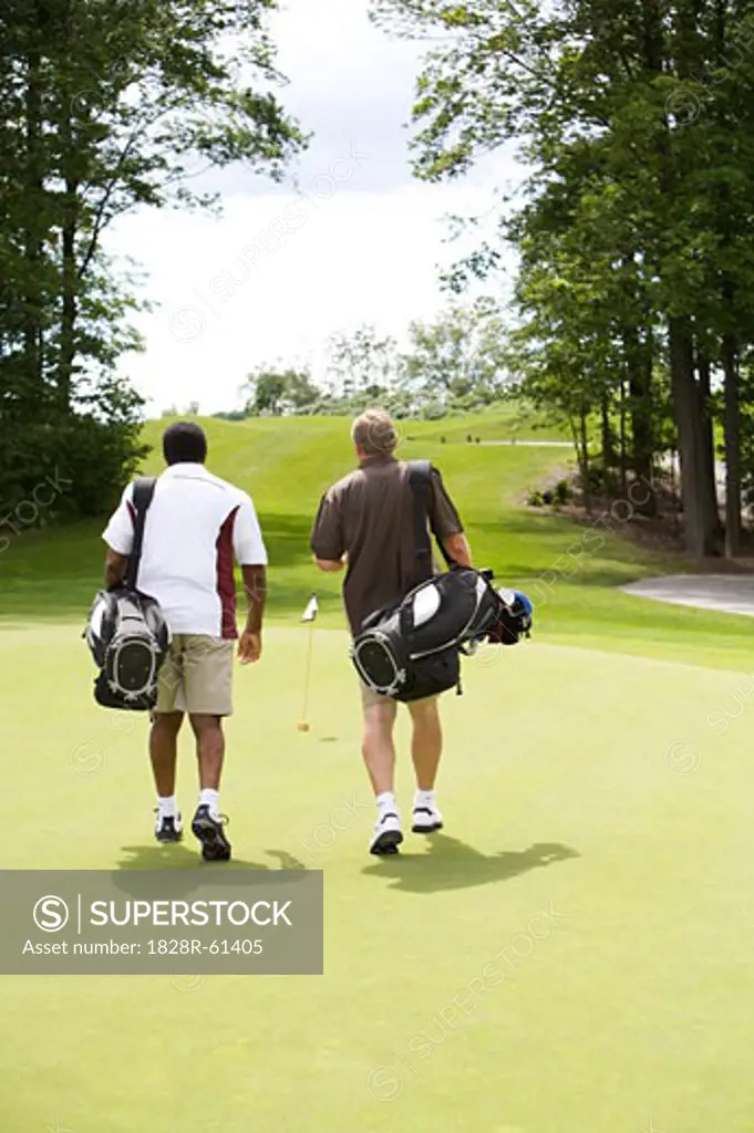Men Walking on Golf Course, Burlignton, Ontario, Canada   