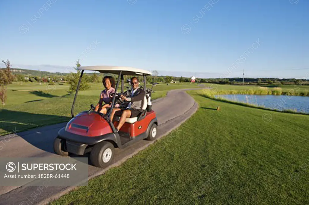 Couple in Golf Cart, Burlington, Ontario, Canada   