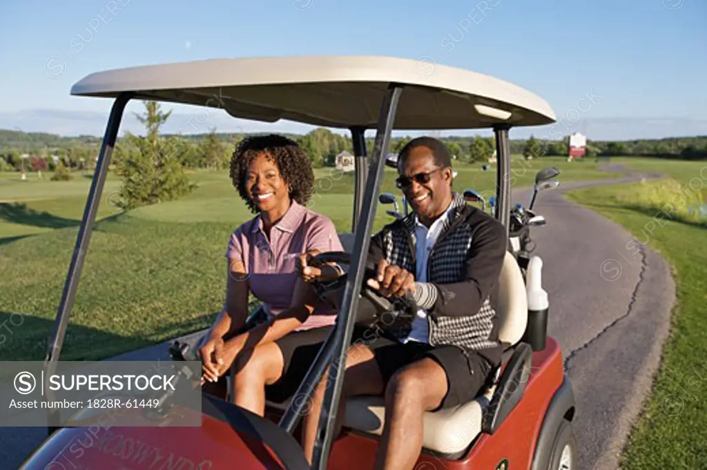 Couple in Golf Cart, Burlington, Ontario, Canada   