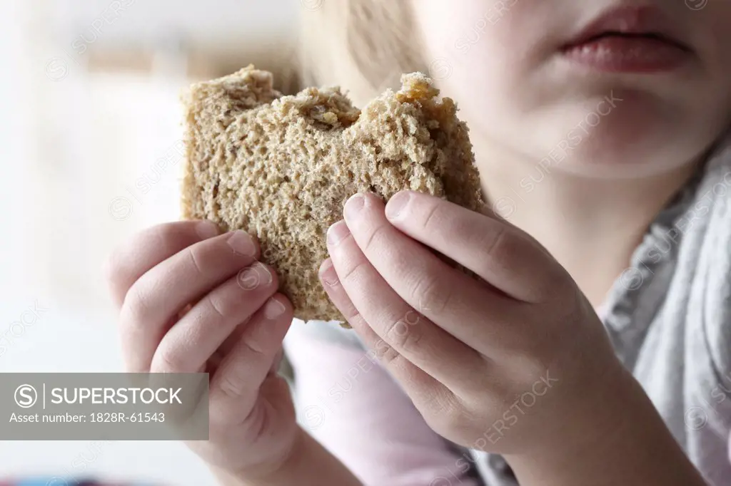 Girl Eating Peanut Butter Sandwich   