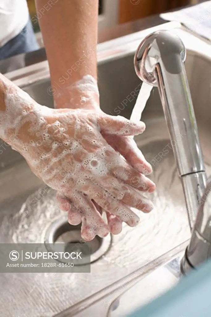 Man Washing his Hands   