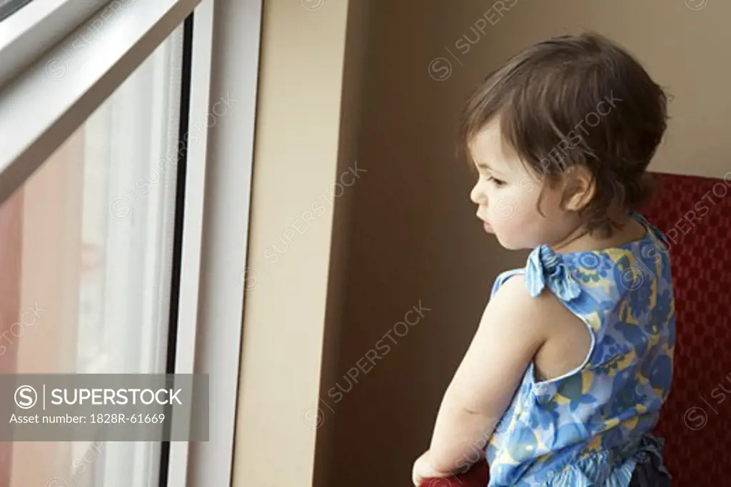 Little Girl Looking Out Window   