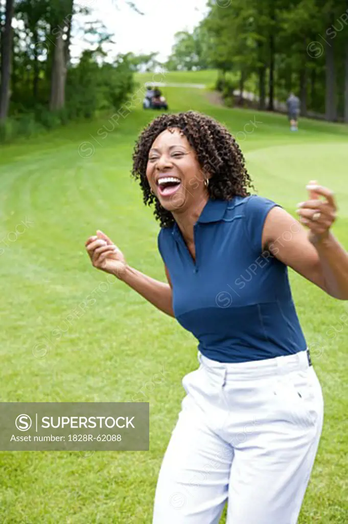 Woman Laughing on Golf Course