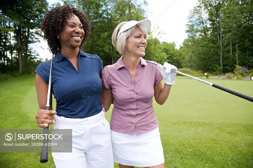 Women Standing on Golf Course