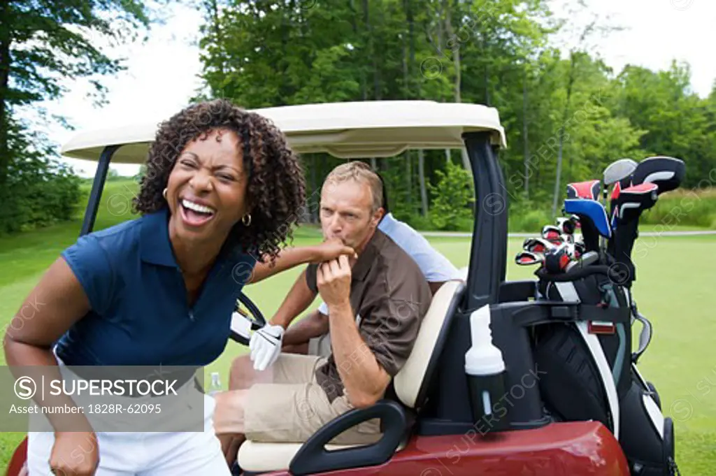 Man Kissing Woman's Hand on Golf Course