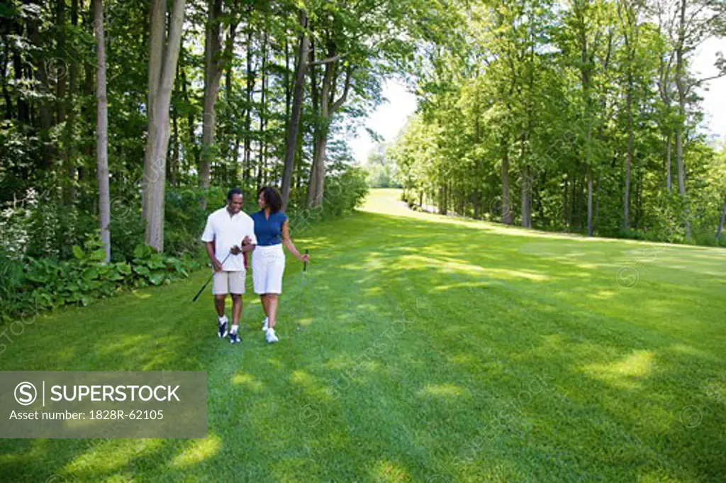 Couple Walking on Golf Course