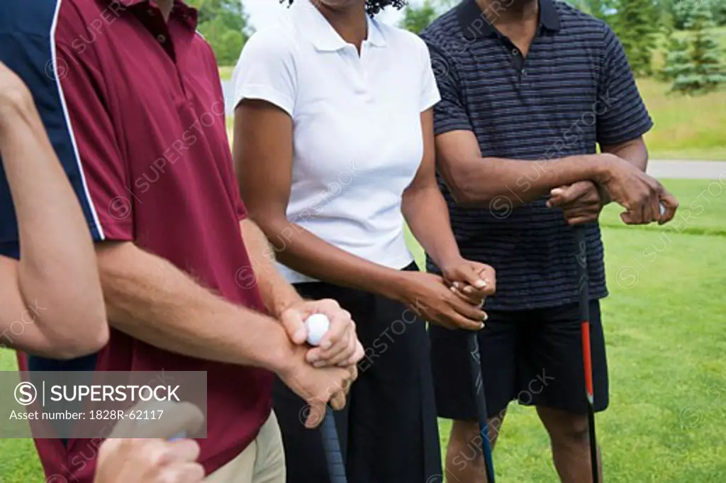 Close-up of People Standing on Golf Course