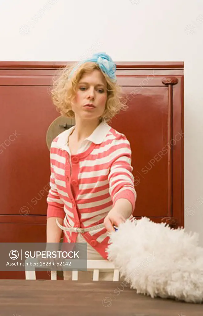 Woman Dusting Table   