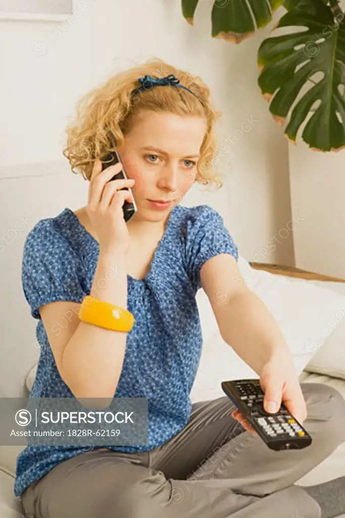 Woman using TV Remote   