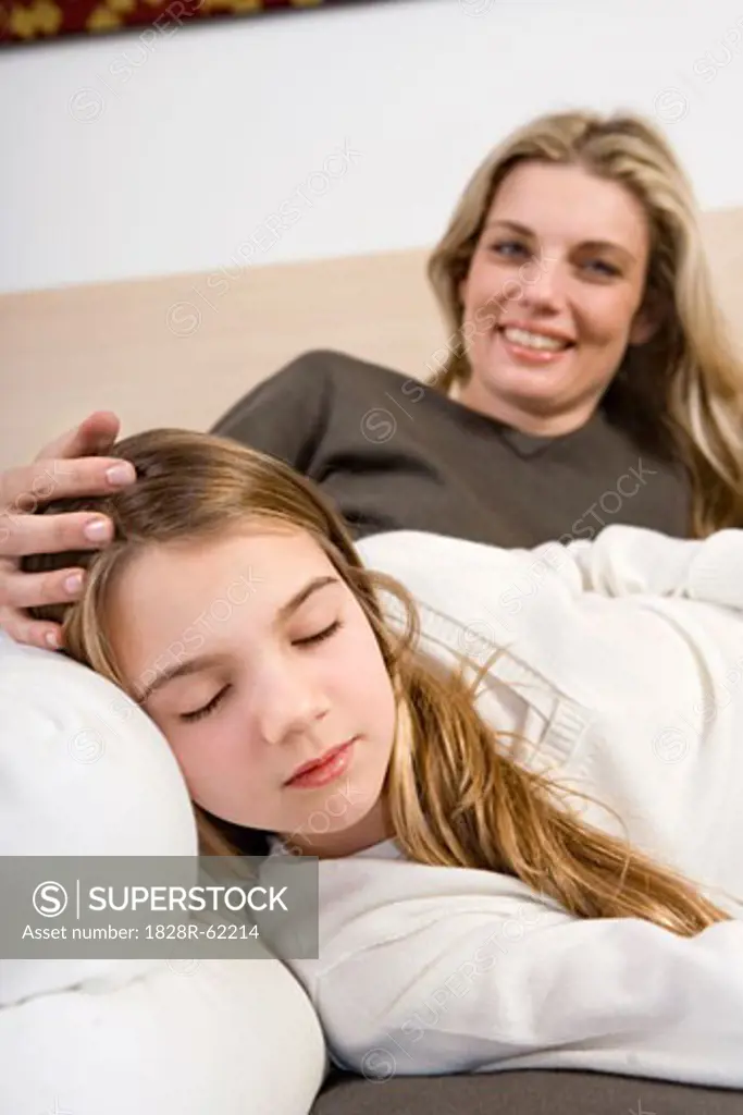 Daughter Sleeping on Mother's Lap   