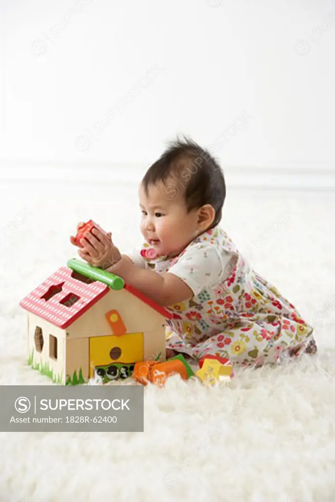 Girl Playing with Shapes and House   