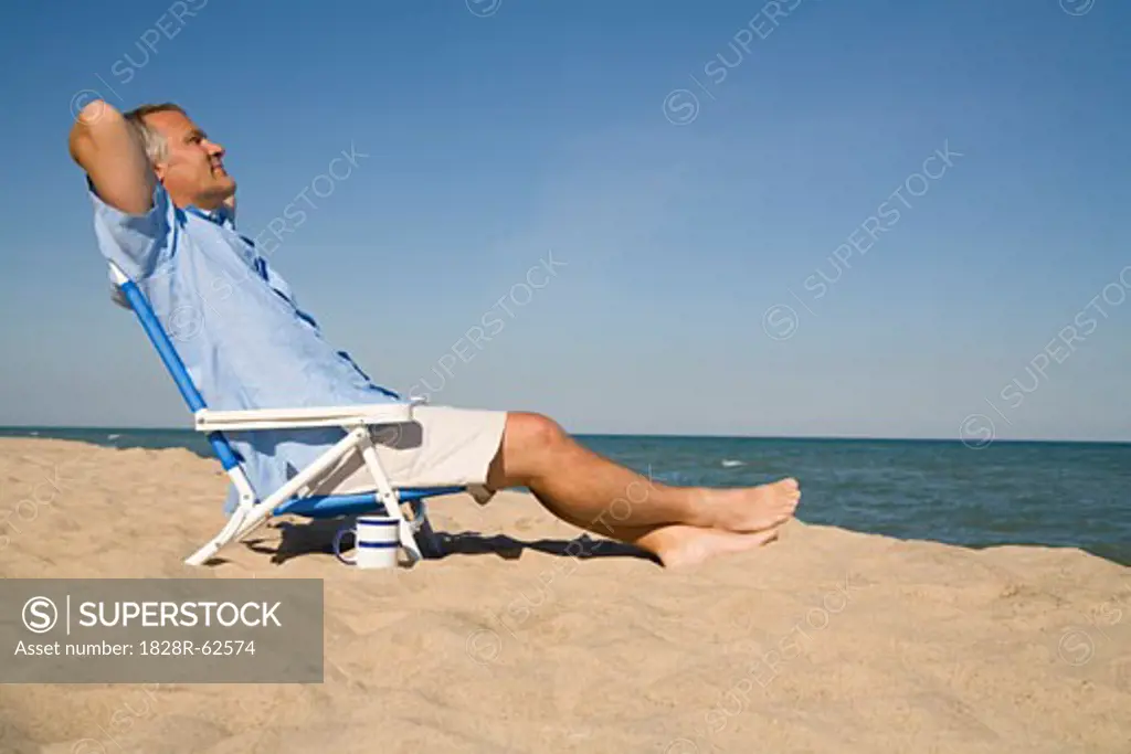 Man Relaxing on the Beach, Lake Michigan, USA