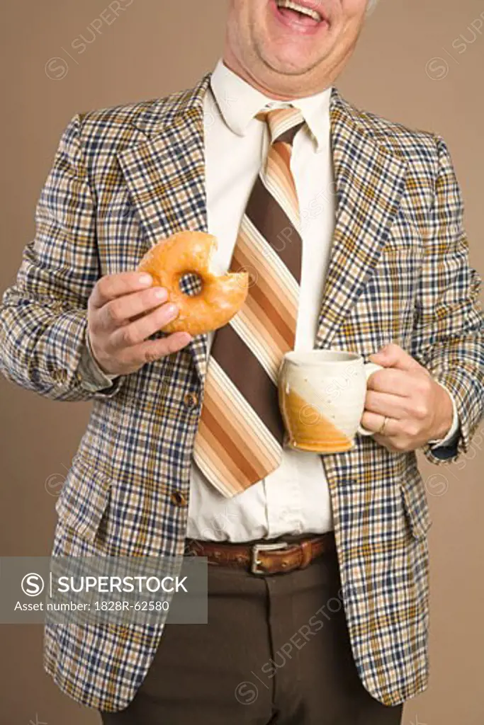 Retro Businessman Eating a Doughnut and Drinking a Cup of Coffee