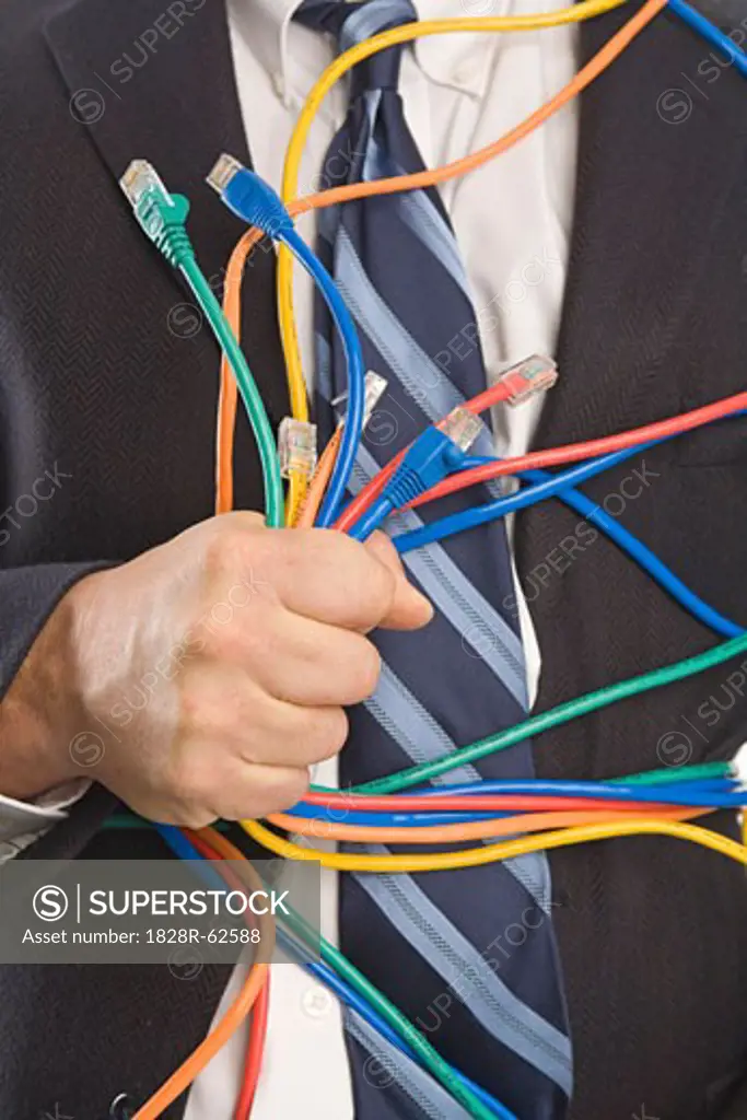Close-up of Businessman Holding CAT5 Cables