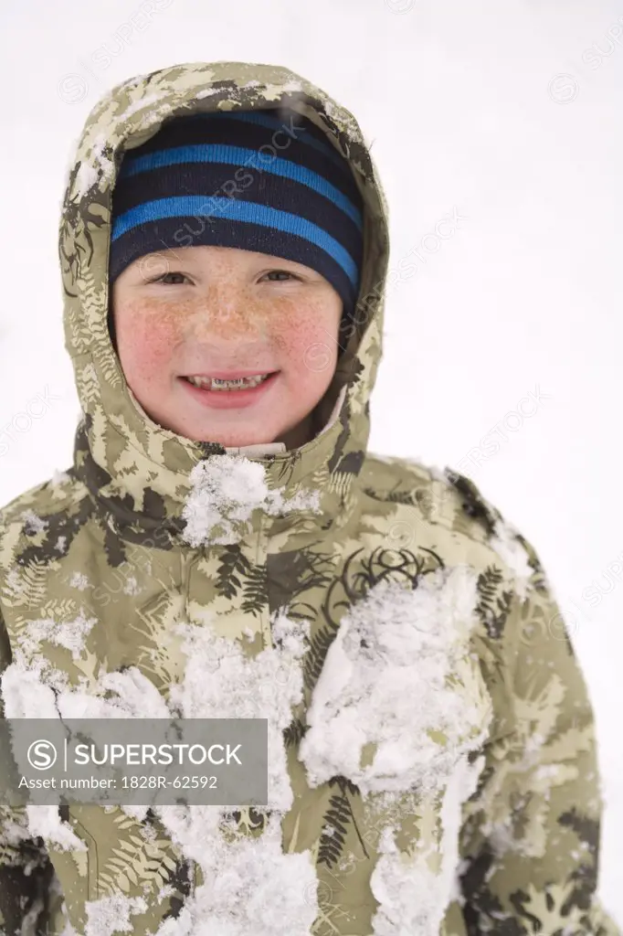 Little Boy Playing in the Snow