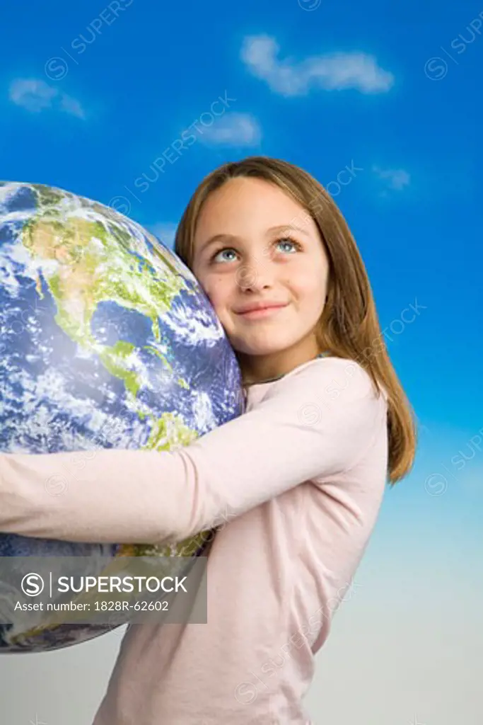 Little Girl Holding a Model of Earth as Seen From Outer Space