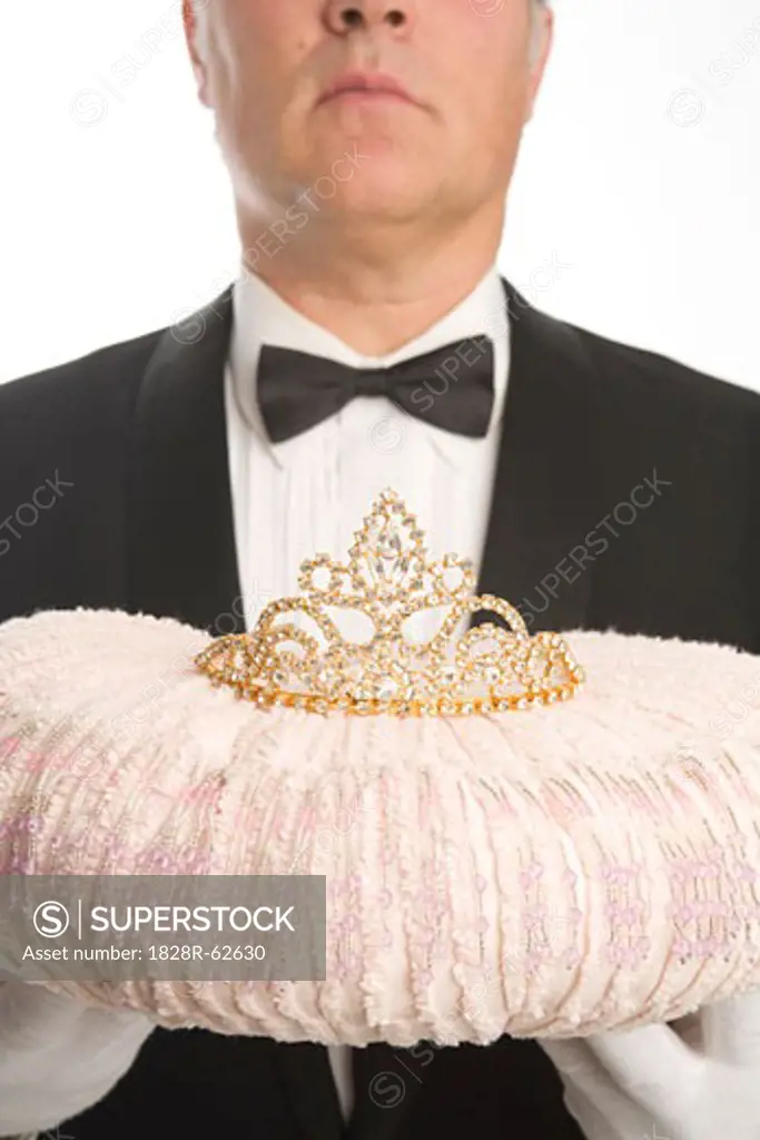 Butler Holding a Tiara on a Cushion   