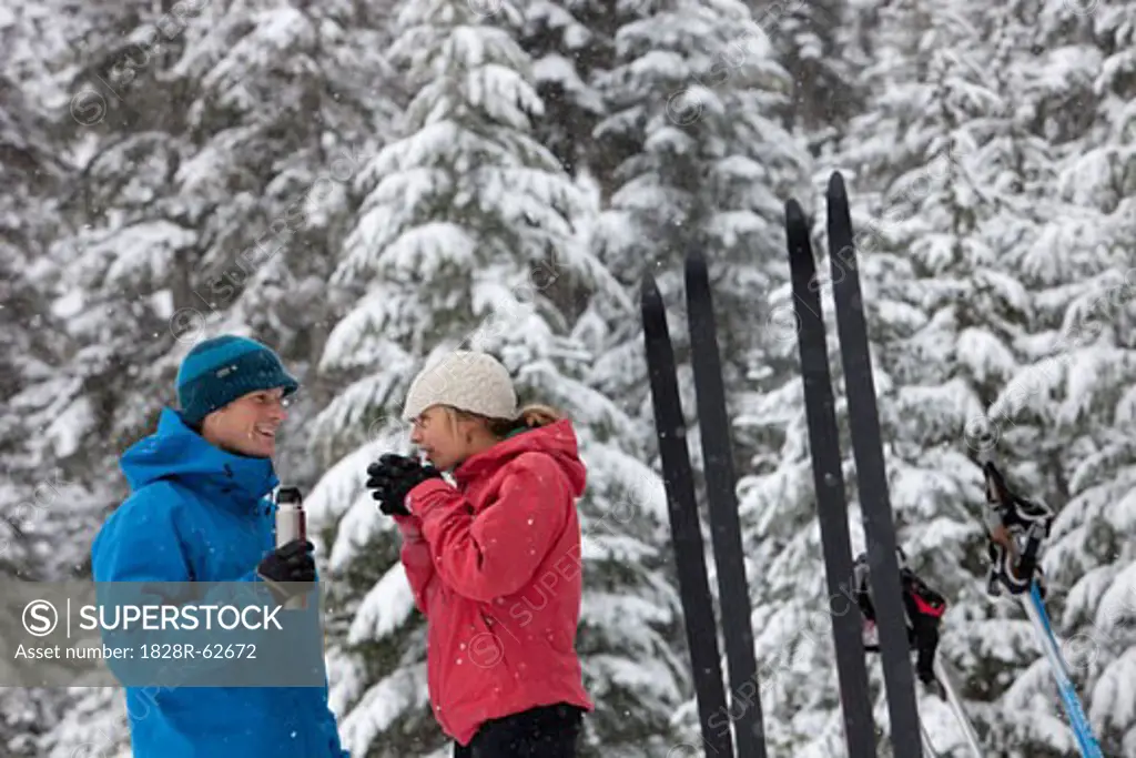 Couple Drinking from Thermos, Cross Country Skiing, Whistler, British Columbia, Canada