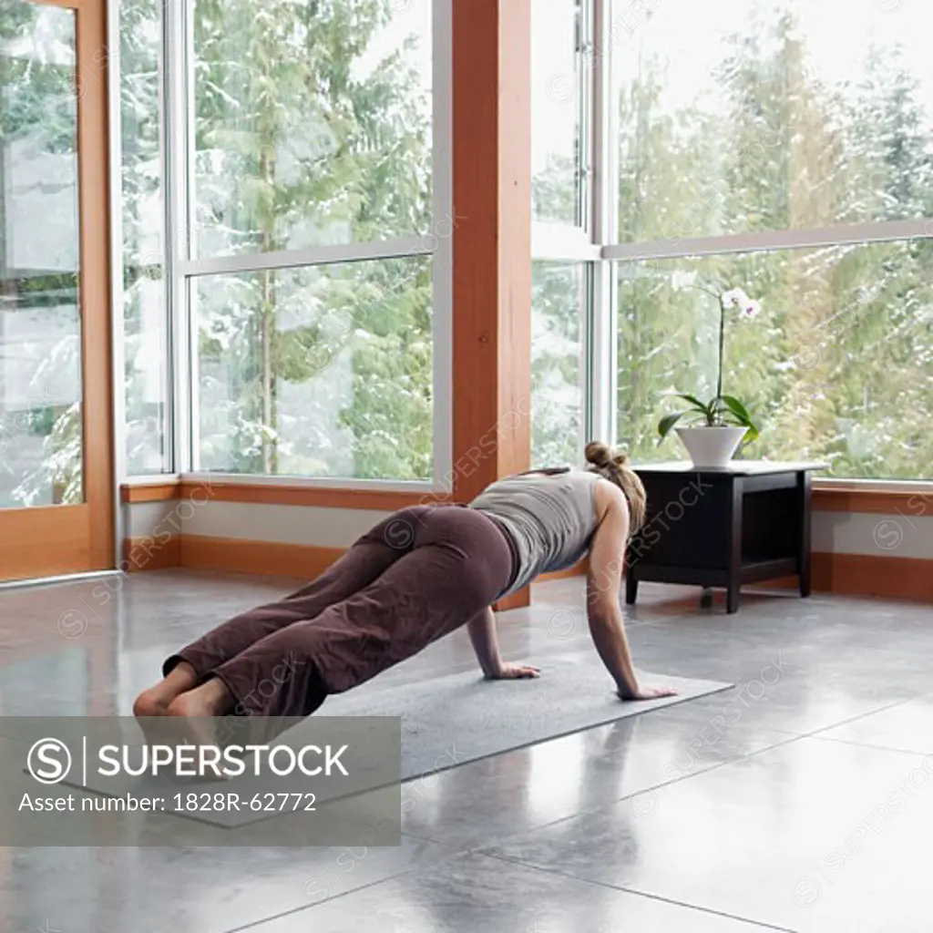 Woman Doing Yoga in Living Room of Large Alpine Home