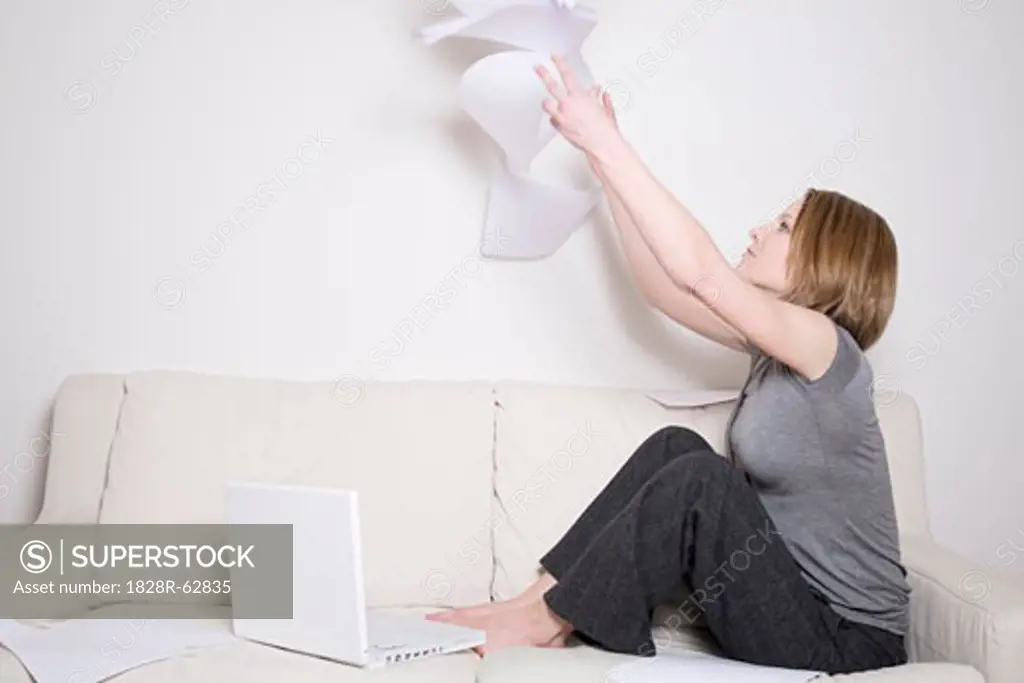 Woman Throwing Papers in the Air
