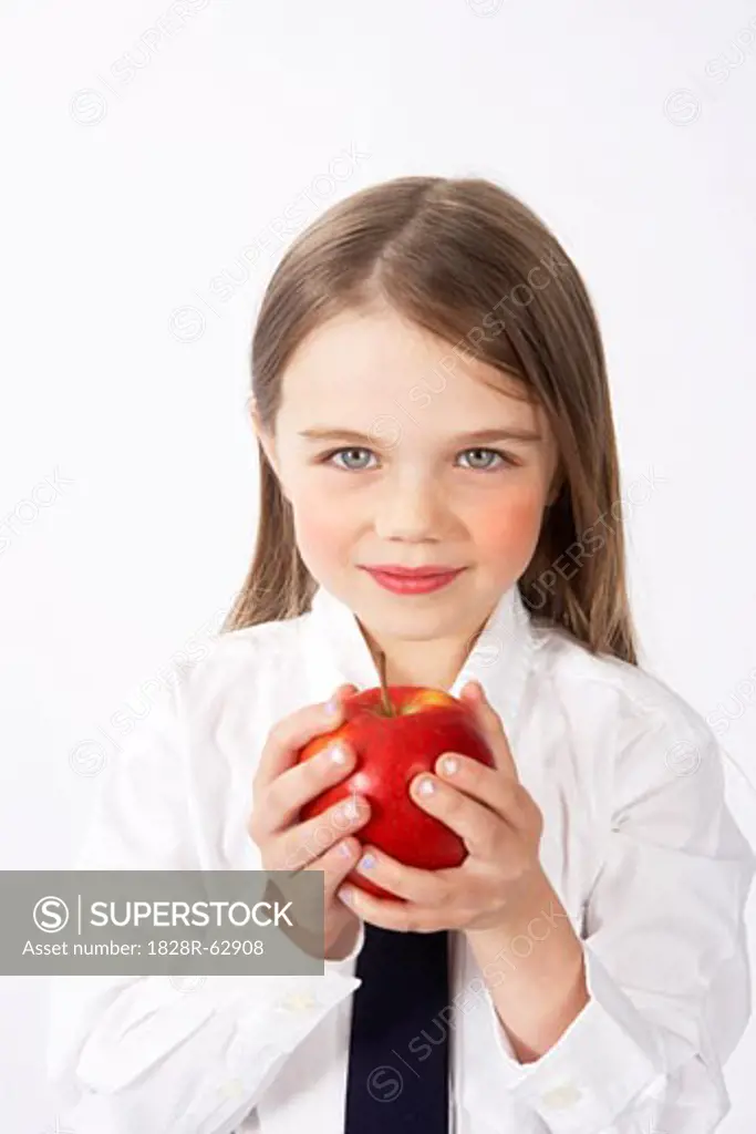 Girl in School Uniform Holding Apple
