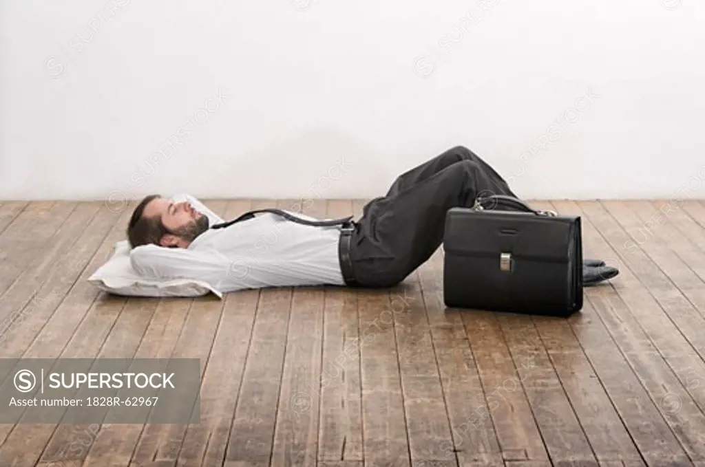 Businessman Lying on Floor