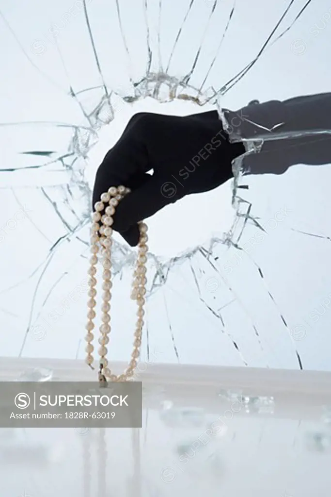 Hand Stealing Pearl Necklace