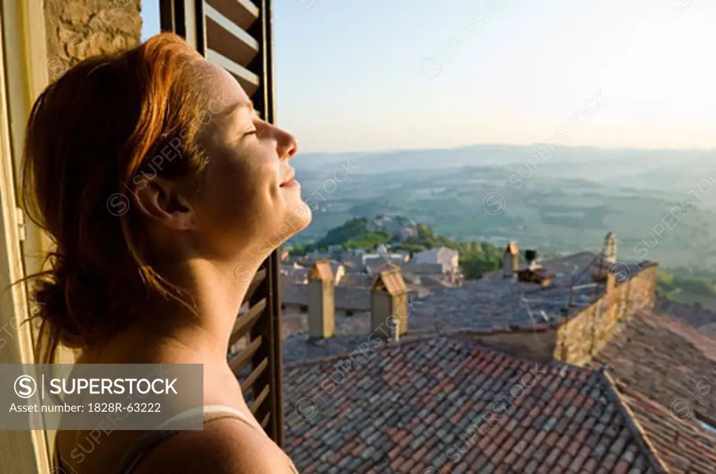Woman at Window, Todi, Province of Perugia, Umbria, Italy