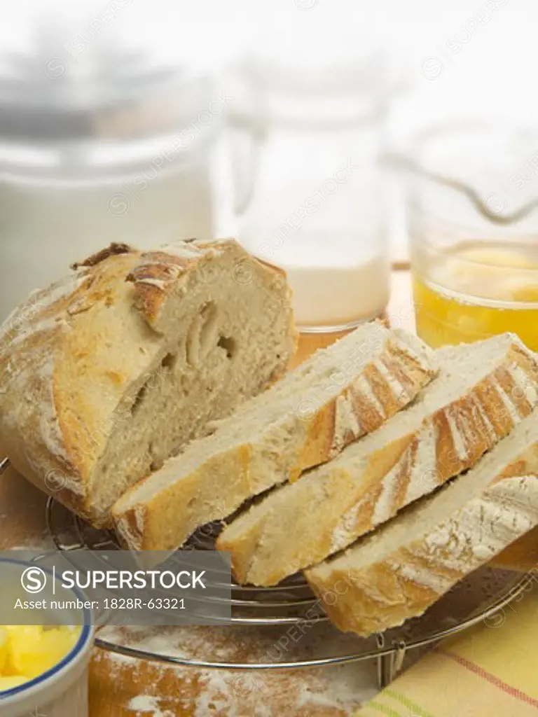White Bread on Cooling Rack With Baking Ingredients